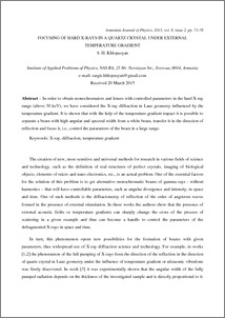 FOCUSING OF HARD X-RAYS IN A QUARTZ CRYSTAL UNDER EXTERNAL TEMPERATURE GRADIENT